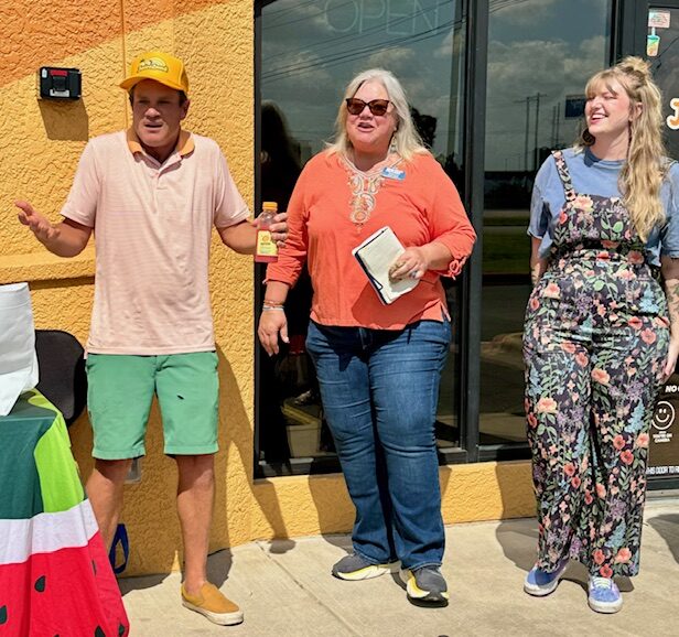 Round the Rock photo: Founder and Owner Matt Shook (left) and Round Rock Store Manager Madison (right) join Karah Powell (center) to talk about the store.