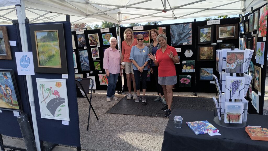 Williamson County Art Guild members at their booth during a local art festival