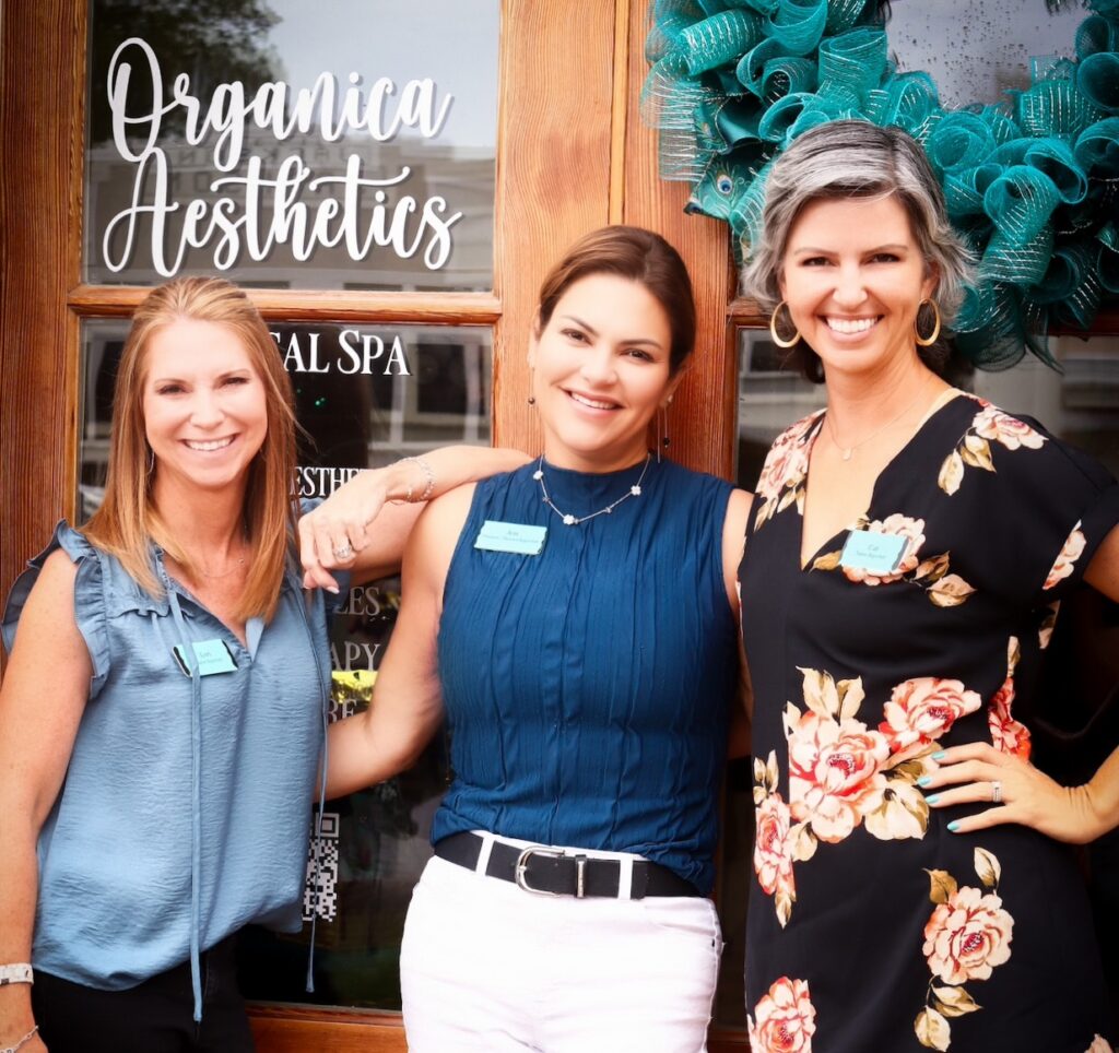Organica Aesthetics team (Lori, Jen, and Cat) outside their downtown Round Rock storefront